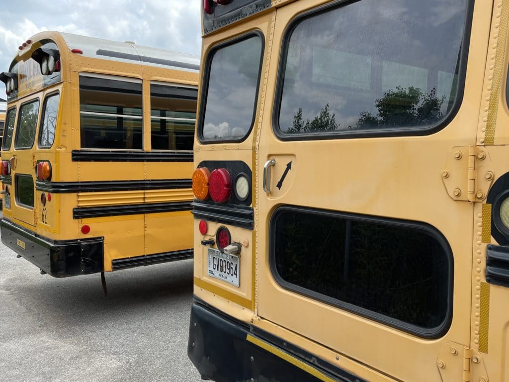 side by side school buses